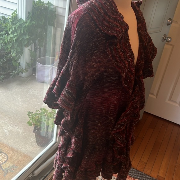 It’s a pretty ruffle cardigan open from the front. Mix of red purple white - Picture 2 of 3